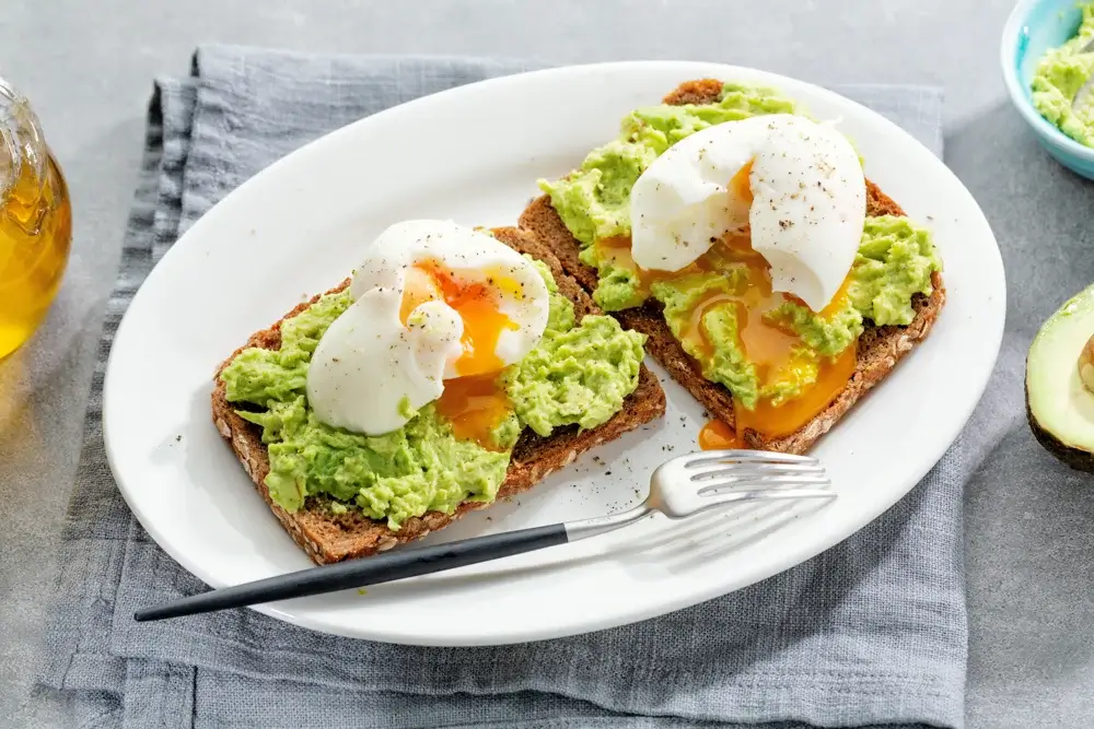 Whole-grain toast with avocado and poached eggs.