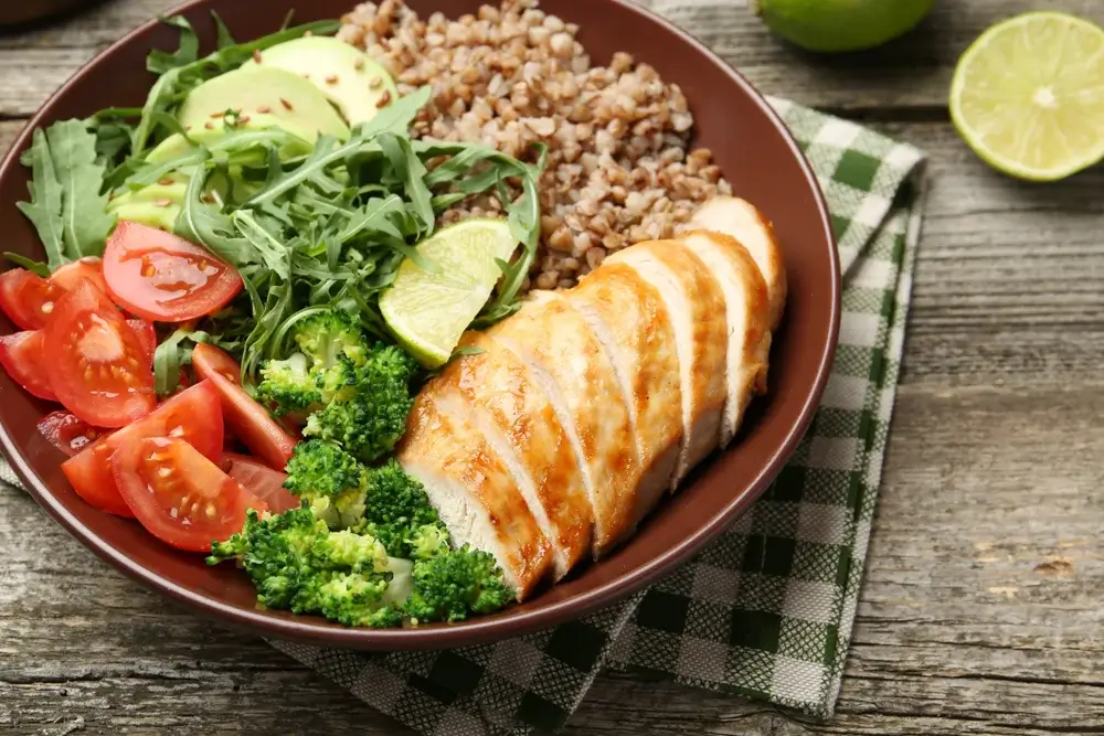 Grilled chicken and quinoa bowl with roasted vegetables.