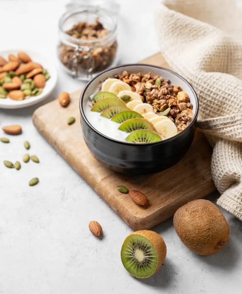 Greek yogurt with sliced kiwi and granola
