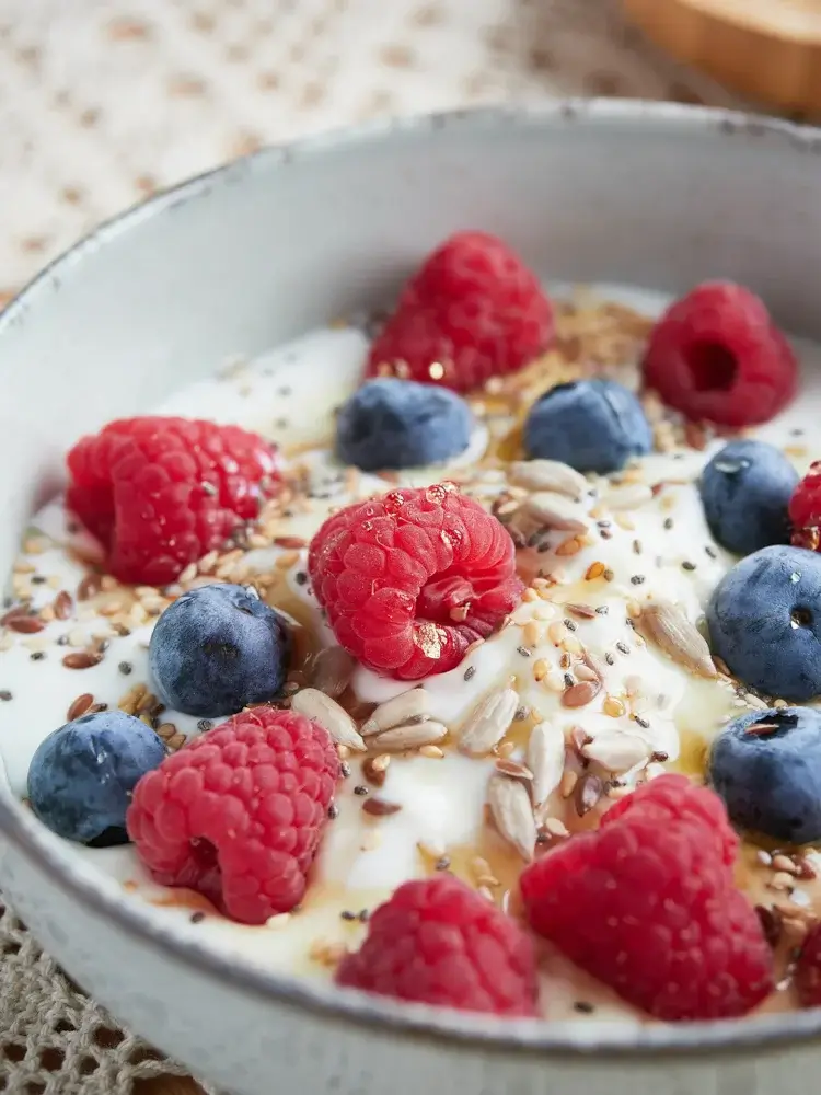 Greek yogurt bowl with mixed berries, ground flaxseed