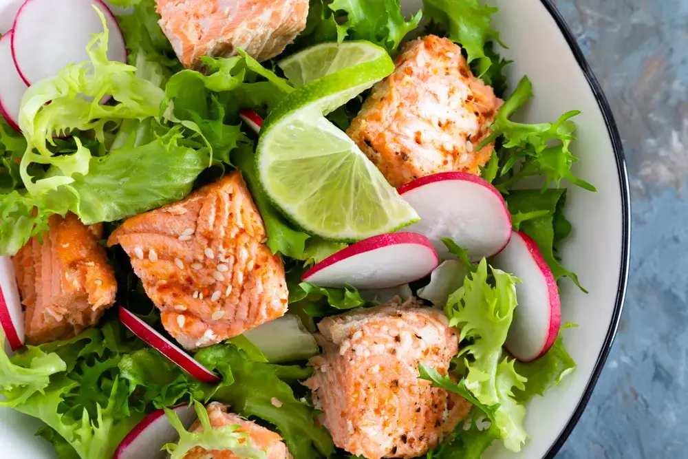 Salmon salad over mixed greens
