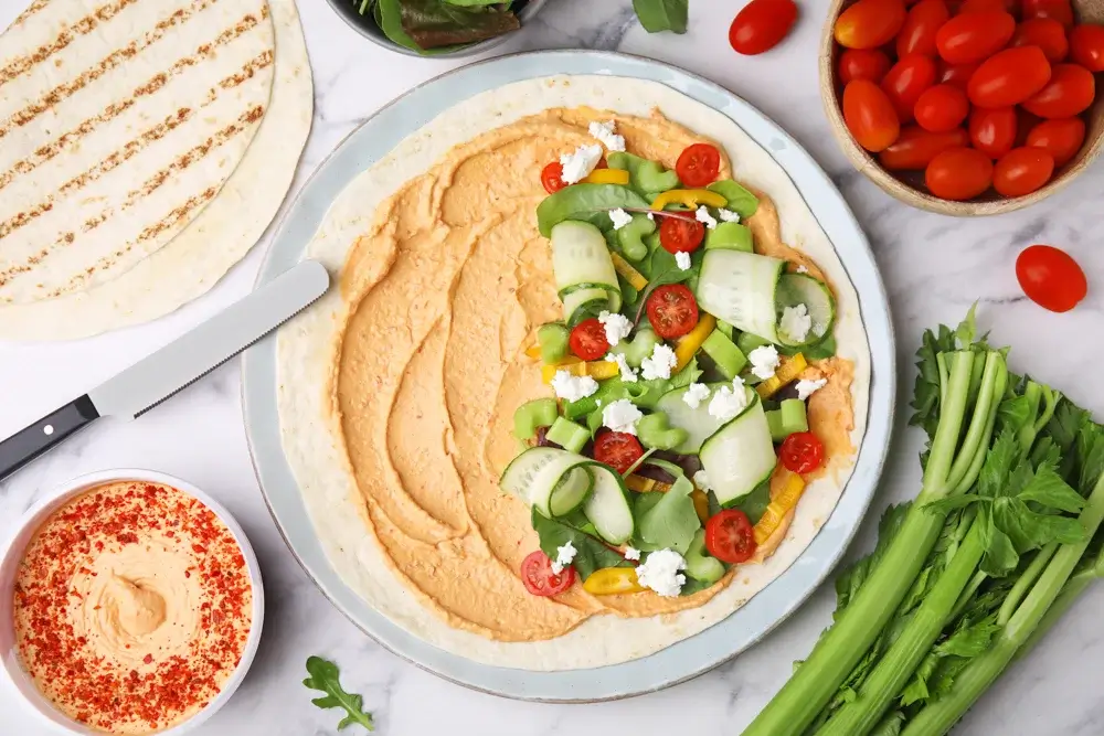 Hummus and veggie wrap in a whole-grain tortilla