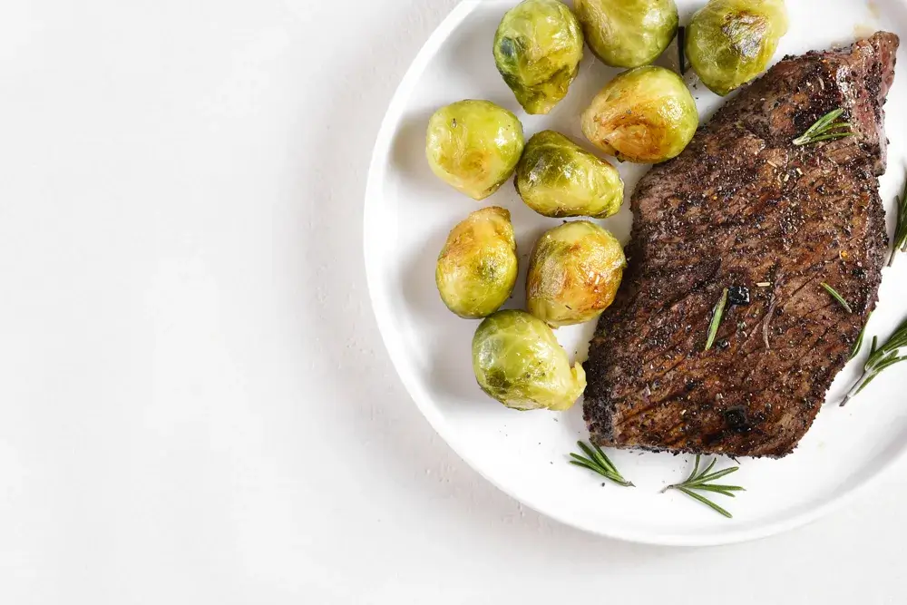 Grilled steak with roasted Brussels sprouts